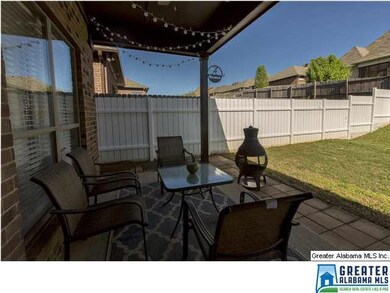 Gorgeous Covered Back Patio with a fan, and a grea