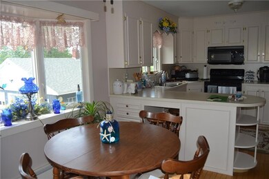 Dining area with bow window off kitchen