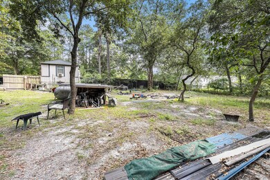 View of yard featuring view of wooded area