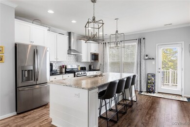 Kitchen with a notable chandelier, stainless steel