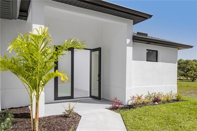View of exterior entry featuring stucco siding