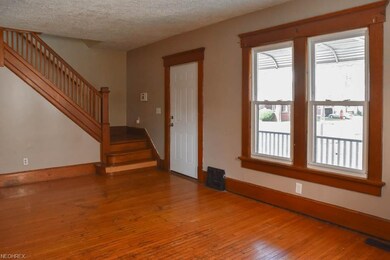 Living room with original hardwood flooring.