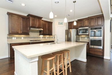 The kitchen, a cozy place for quick bites and midnight snacks.  Featuring granite counter tops, stainless steel appliances, gas cook top, double oven, built-in microwave, and a deep stainless steel sink.