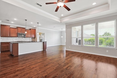 Kitchen opens to Living Room and Dining Room