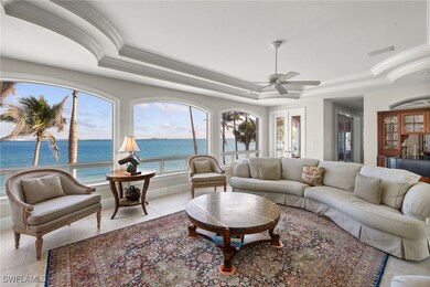 Living room with light tile patterned floors, a tr