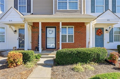 Front with brick & covered front porch