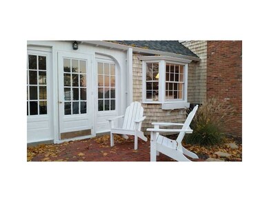 Exterior Front. Breezeway entry with brick patio o