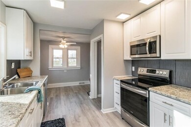 View of kitchen and dining area.