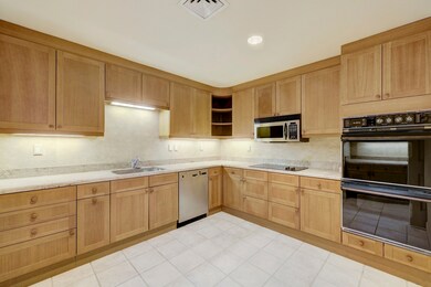 Well planned Kitchen with wood finished cabinetry,
