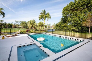 View of patio with outdoor lounge area, a swimming