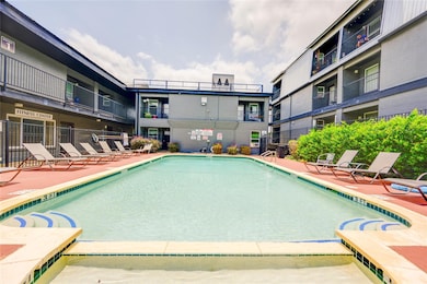 Community pool featuring a patio area