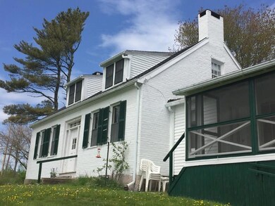 Water side of house and screened in...
