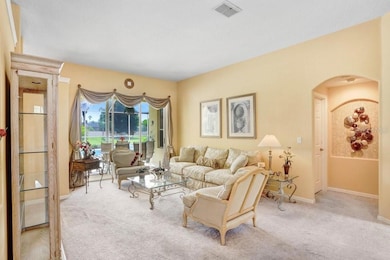 Formal living room with sliding doors to the pool deck