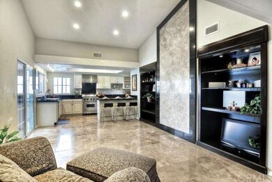 Large Family Room Open to Kitchen with Custom Buil