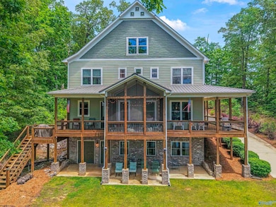 Security and privacy of a gated community w/nature trails & underground utilities, a secluded cove location w/view of the dam at main channel a gentle slope to the the deep water access provided by a Wahoo aluminum walkway& dock with hoist