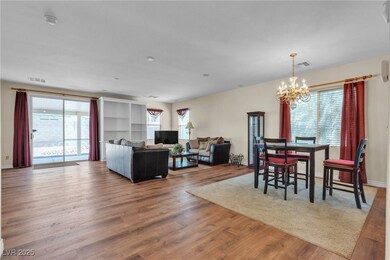 Living room featuring a chandelier, plenty of natu