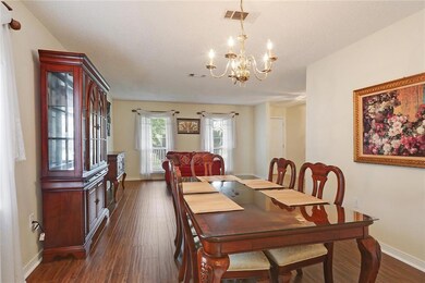 Formal dining open to den