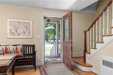 Foyer with beautiful hardwood flooring.