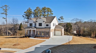 Modern inspired home with driveway, an attached ga