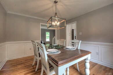 While freshly-painted wainscoting provides a backd