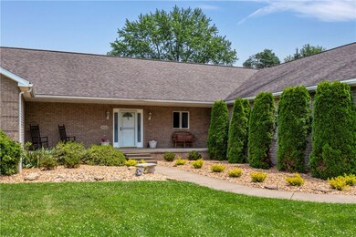 ENJOY THE COVERED FRONT PORCH TO GATHER AND RELAX ON