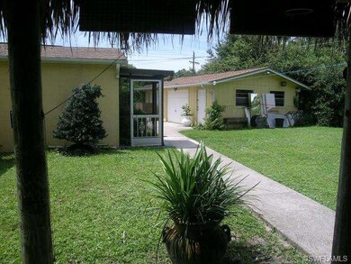 4131 Coconut Circle N. Side Yard from Chickee