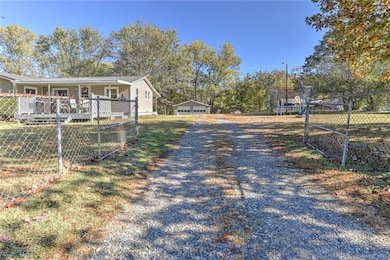 Driveway and Fenced Yard to Garage