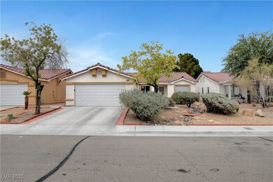View of front of home with a garage, concrete driv