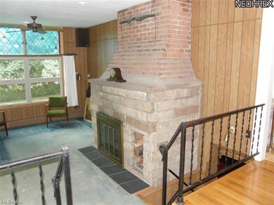Unique family room with huge stone fireplace. orig