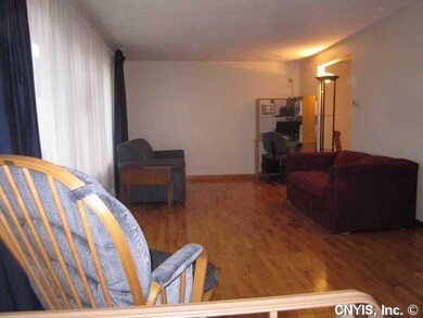 Living Room. Inside you will find gleaming hardwoo