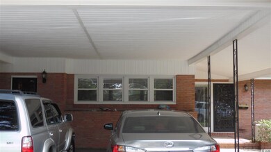 Outside storage to the left of the carport.