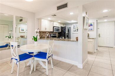 Kitchen featuring light stone countertops, stainle