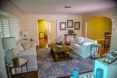 Formal living room with view into bedroom 4 and th