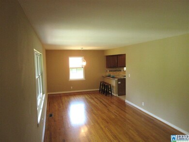 That is open to the kitchen with breakfast bar.