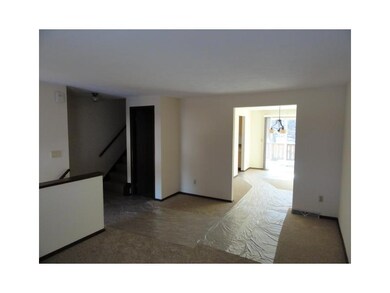 Living Room. looking into the Dining Room.. then sliding glass doors onto a deck over looking the woods