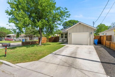 View of front of house featuring concrete drivewa