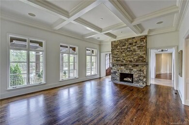 The family room has a wall of windows overlooking 