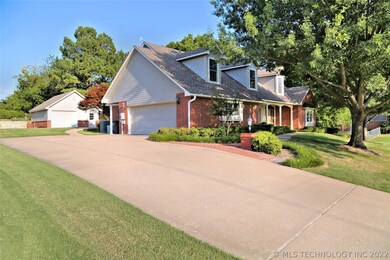 Extra large drive leads to 2 car garage and detach