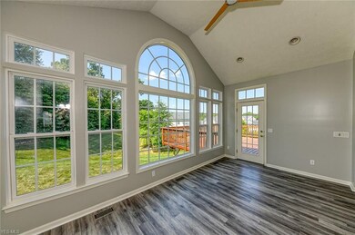 The morning room opens to an expansive wood deck o