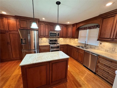 Kitchen featuring sink, stainless steel appliances