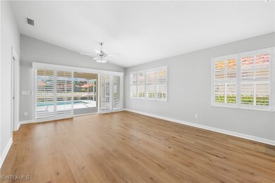 Living room with ceiling fan, healthy amount of na