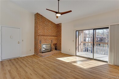 Living room with ceiling fan, high vaulted ceiling