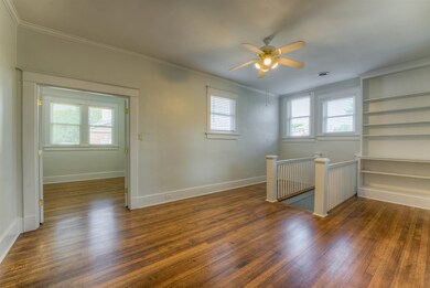 Spare room featuring ornamental molding, a healthy