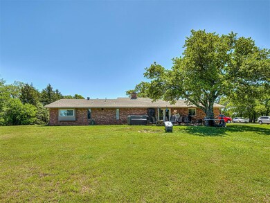 Single story home featuring a front lawn and centr