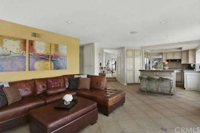 Open to a large family room with tiled floors....