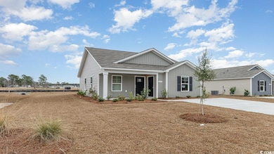 View of front of house featuring central AC unit, board and batten siding, and a porch