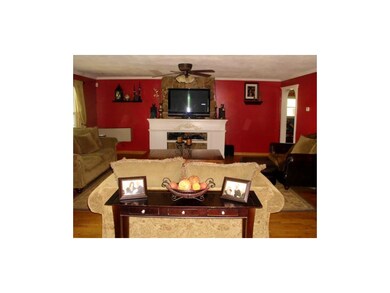 Spacious living room with warm wall colors.