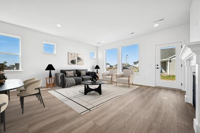 Virtually staged living room and dining room areas.