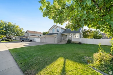 Traditional-style house with concrete driveway and brick siding