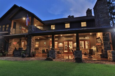 ENJOY QUIET EVENINGS ON THE HUGE COVERED PATIO WITH OUTDOOR KITCHEN AND LIVING AREA WITH FIREPLACE!